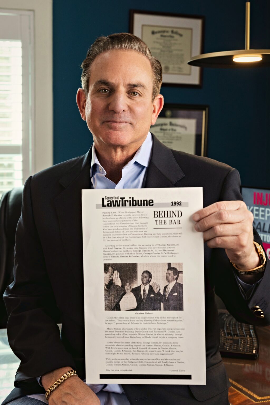 Attorney Tom Ganim holding the 1992 Connecticut Law Tribune article Behind the Bar